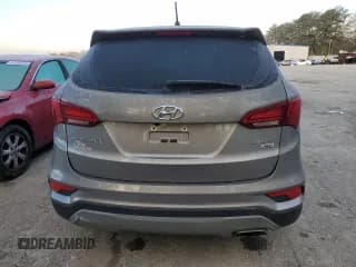 ✅ 2018 Hyundai Santa Fe 2.4L • VIN: 5XYZTDLB0JG562768 • Лот: 45202753. Опубликован ранее на Copart с пробегом Не указан. Бесплатный доступ к архиву аукционных продаж из США и подробный отчёт об истории автомобиля на DreamBid. Изображение 6.