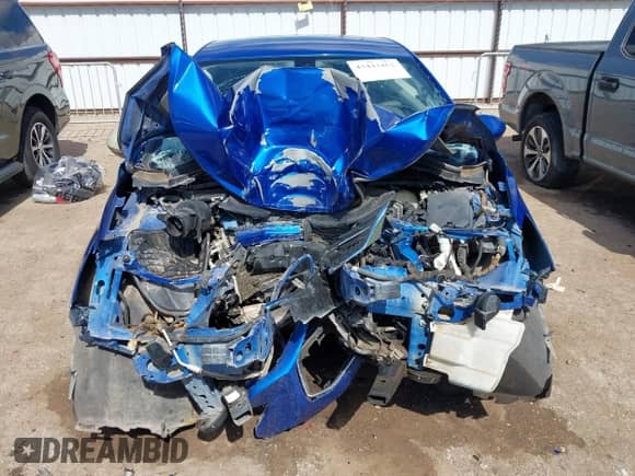 2018 Chevrolet Cruze LT z VIN 1G1BE5SM0J7147802, wystawiony jako IAAI lot #43443462 z przebiegiem Nie podano mil oraz . Historia ofert i sprzedaży dostępna na DreamBid. Obrazek 11.