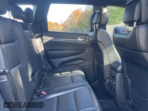 2018 Jeep Grand Cherokee Sterling z VIN 1C4RJFBG8JC162167, wystawiony jako Copart lot #91731335 z przebiegiem 128 078 mil mil oraz Czysty tytuł • Clean title. Historia ofert i sprzedaży dostępna na DreamBid. Obrazek 6.