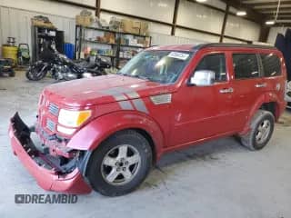 2011 Dodge Nitro Shock z VIN 1D4PT7GX5BW565879, wystawiony jako Copart lot #82068754 z przebiegiem 148 954 mil mil oraz Szkoda całkowita • Salvage title. Historia ofert i sprzedaży dostępna na DreamBid. Obrazek 1.