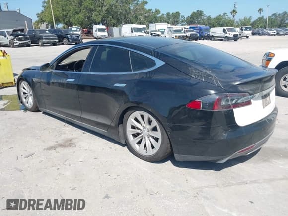 ✅ 2014 Tesla Model S P85D • VIN: 5YJSA1H25EFP65571 • Lot: 42185442. Listed on IAAI with 115,990 mi. Free auction sales archive from the USA and detailed vehicle history report at DreamBid. Image 3.