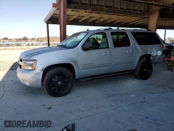 2013 Chevrolet Suburban LT with VIN 1GNSKJE79DR213312, listed as a Copart auction lot 70356745 with 79,474 mi miles and Salvage title. Bid and sale history available at DreamBid. Image 1.