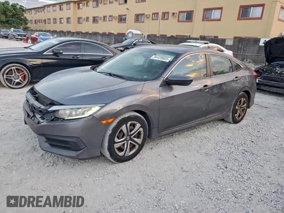 ✅ 2017 Honda Civic LX • VIN: 19XFC2F59HE017124 • Lot: 94428665. Wystawiony na Copart z przebiegiem 141 765 mil. Bezpłatny archiwum sprzedaży aukcyjnych z USA i szczegółowy raport historii pojazdu na DreamBid. Zdjęcie 1.