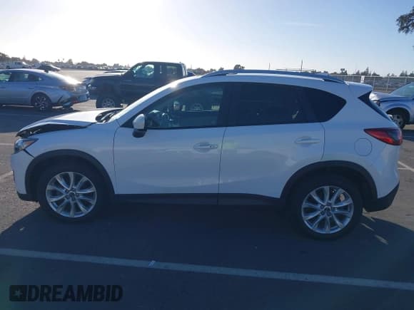 ✅ 2014 Mazda CX-5 Grand Touring • VIN: JM3KE2DY4E0307773 • Lot: 43643721. Wystawiony na IAAI z przebiegiem 117 548 mil. Bezpłatny archiwum sprzedaży aukcyjnych z USA i szczegółowy raport historii pojazdu na DreamBid. Zdjęcie 14.