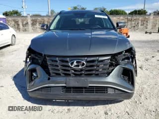 ✅ 2022 Hyundai Tucson SEL Convenience • VIN: KM8JFCA18NU016583 • Lot: 77671394. Wystawiony na Copart z przebiegiem 33 682 mil. Bezpłatny archiwum sprzedaży aukcyjnych z USA i szczegółowy raport historii pojazdu na DreamBid. Zdjęcie 5.