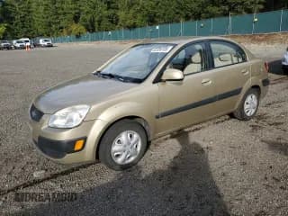 ✅ 2009 Kia Rio • VIN: KNADE223X96548164 • Lot: 82336185. Wystawiony na Copart z przebiegiem 162 731 mil. Bezpłatny archiwum sprzedaży aukcyjnych z USA i szczegółowy raport historii pojazdu na DreamBid. Zdjęcie 1.