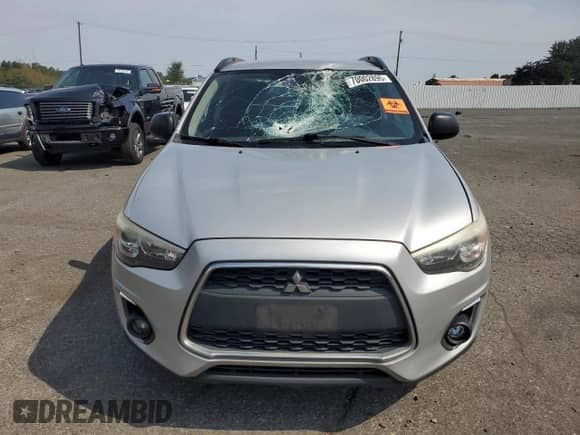 2013 Mitsubishi Outlander LE with VIN 4A4AR5AU1DE022535, listed as a Copart auction lot 70002895 with 297,561 mi miles and Salvage title. Bid and sale history available at DreamBid. Image 5.