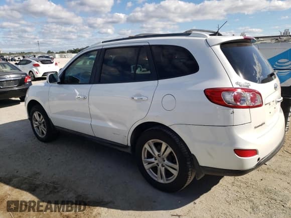 ✅ 2012 Hyundai Santa Fe Limited • VIN: 5XYZKDAG4CG159736 • Lot: 81399854. Listed on Copart with 230,825 mi. Free auction sales archive from the USA and detailed vehicle history report at DreamBid. Image 2.