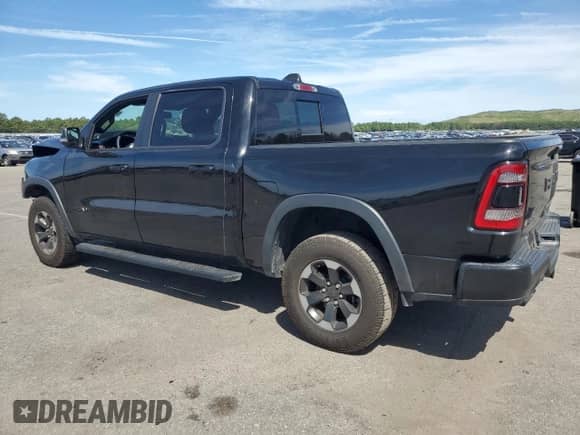 2019 Ram 1500 Rebel z VIN 1C6SRFLT0KN698856, wystawiony jako Copart lot #69225485 z przebiegiem 143 146 mil mil oraz Szkoda całkowita • Salvage title. Historia ofert i sprzedaży dostępna na DreamBid. Obrazek 2.