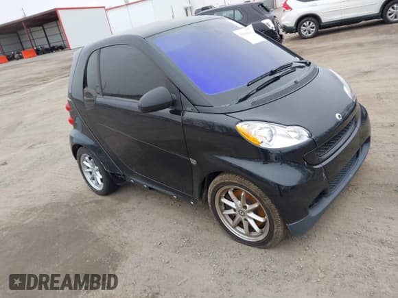 ✅ 2009 Smart fortwo Pure • VIN: WMEEJ31X49K254488 • Lot: 43818664. Listed on IAAI with Not provided. Free auction sales archive from the USA and detailed vehicle history report at DreamBid. Image 1.