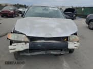 ✅ 2001 Mazda Protege DX • VIN: JM1BJ222310425181 • Lot: 88560255. Wystawiony na Copart z przebiegiem 201 942 mil. Bezpłatny archiwum sprzedaży aukcyjnych z USA i szczegółowy raport historii pojazdu na DreamBid. Zdjęcie 5.