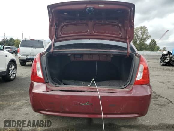 2010 Hyundai Accent GLS z VIN KMHCN4AC9AU423907, wystawiony jako Copart lot #85865405 z przebiegiem 161 041 mil mil oraz Szkoda całkowita • Salvage title. Historia ofert i sprzedaży dostępna na DreamBid. Obrazek 6.