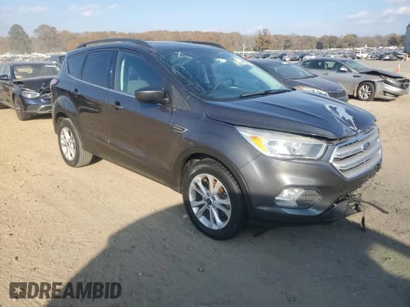 ✅ 2018 Ford Escape SE • VIN: 1FMCU0GD1JUB76040 • Lot: 93691925. Listed on Copart with 141,946 mi. Free auction sales archive from the USA and detailed vehicle history report at DreamBid. Image 4.