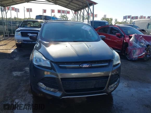 ✅ 2016 Ford Escape SE • VIN: 1FMCU9GX4GUC20913 • Lot: 43420226. Listed on IAAI with 112,669 mi. Free auction sales archive from the USA and detailed vehicle history report at DreamBid. Image 12.