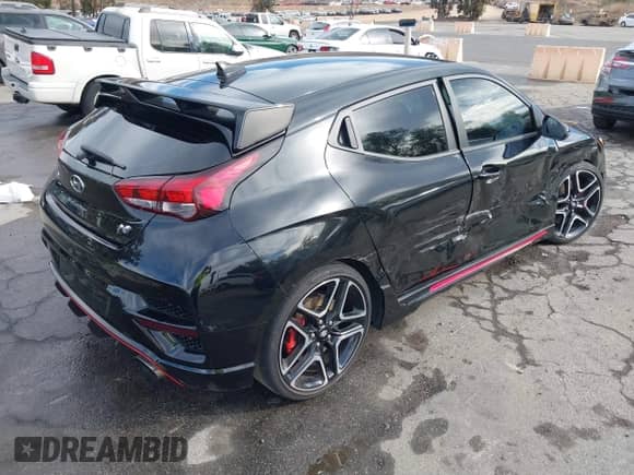 2022 Hyundai Veloster with VIN KMHT36AH1NU014206, listed as a IAAI auction lot 41202982 with 26,572 mi miles and . Bid and sale history available at DreamBid. Image 4.