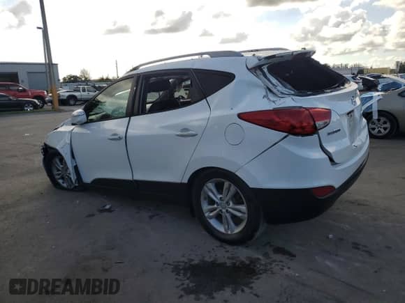 2013 Hyundai Tucson GLS with VIN KM8JU3AC6DU757207, listed as a Copart auction lot 89450945 with 164,630 mi miles and Salvage title. Bid and sale history available at DreamBid. Image 2.