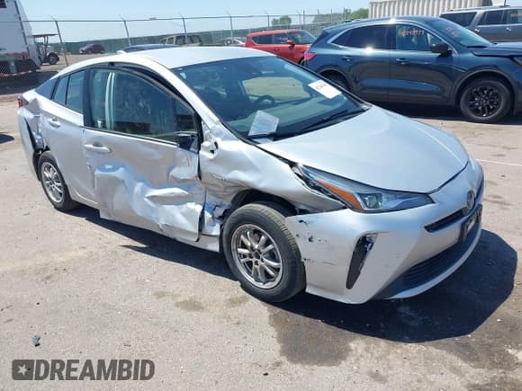 ✅ 2021 Toyota Prius L Eco • VIN: JTDKAMFU4M3148082 • Lot: 42246788. Listed on IAAI with 72,124 mi. Free auction sales archive from the USA and detailed vehicle history report at DreamBid. Image 1.