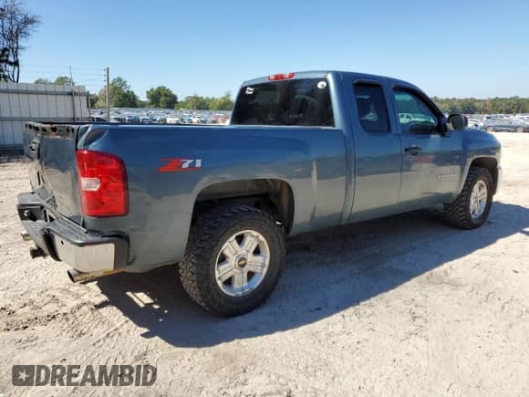 2012 Chevrolet Silverado 1500 LT with VIN 1GCRCSE02CZ148654, listed as a Copart auction lot 86171285 with 218,565 mi miles and Salvage title. Bid and sale history available at DreamBid. Image 3.