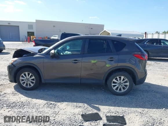 ✅ 2016 Mazda CX-5 Touring • VIN: JM3KE4CY1G0894238 • Lot: 43371114. Listed on IAAI with 141,561 mi. Free auction sales archive from the USA and detailed vehicle history report at DreamBid. Image 14.