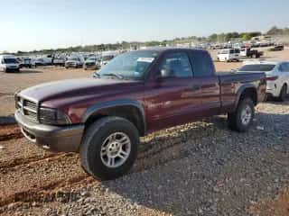 2002 Dodge Dakota z VIN 1B7GG12XX2S570878, wystawiony jako Copart lot #75023704 z przebiegiem 109 421 mil mil oraz Szkoda całkowita • Salvage title. Historia ofert i sprzedaży dostępna na DreamBid. Obrazek 1.