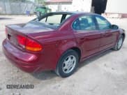 ✅ 2002 Oldsmobile Alero GX • VIN: 1G3NK52F52C303839 • Lot: 42632849. Listed on IAAI with 134,169 mi. Free auction sales archive from the USA and detailed vehicle history report at DreamBid. Image 4.