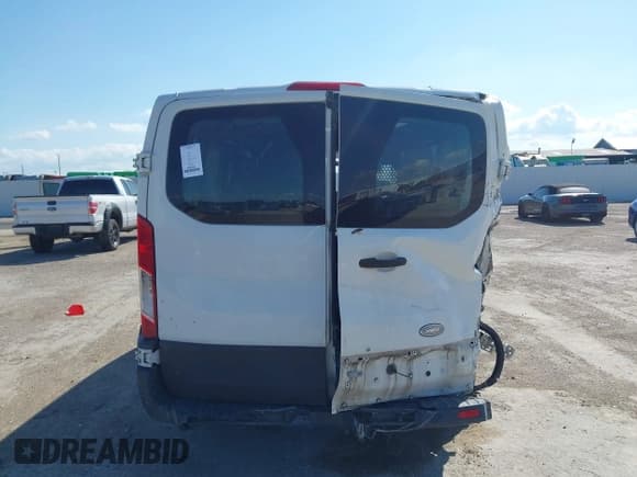 ✅ 2015 Ford Transit Cargo • VIN: 1FTNE1YM7FKA17475 • Lot: 42462385. Listed on IAAI with 247,034 mi. Free auction sales archive from the USA and detailed vehicle history report at DreamBid. Image 16.