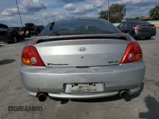 ✅ 2003 Hyundai Tiburon GT • VIN: KMHHN65F03U055237 • Лот: 82400615. Опубликован ранее на Copart с пробегом 244 468 миль. Бесплатный доступ к архиву аукционных продаж из США и подробный отчёт об истории автомобиля на DreamBid. Изображение 6.