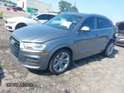 ✅ 2017 Audi Q3 Premium Plus • VIN: WA1JCCFS8HR003056 • Lot: 42570081. Listed on IAAI with 82,210 mi. Free auction sales archive from the USA and detailed vehicle history report at DreamBid. Image 2.