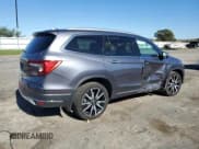 ✅ 2020 Honda Pilot Touring 7-Passenger • VIN: 5FNYF6H67LB028560 • Lot: 82624265. Wystawiony na Copart z przebiegiem 73 131 mil. Bezpłatny archiwum sprzedaży aukcyjnych z USA i szczegółowy raport historii pojazdu na DreamBid. Zdjęcie 3.