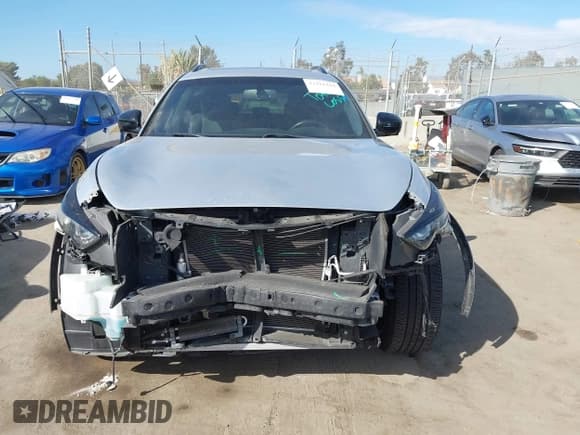 ✅ 2016 Infiniti QX70 • VIN: JN8CS1MU5GM670970 • Lot: 43421444. Listed on IAAI with 34,520 mi. Free auction sales archive from the USA and detailed vehicle history report at DreamBid. Image 13.