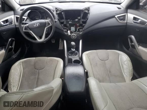 2012 Hyundai Veloster w/Red Int z VIN KMHTC6AD2CU021143, wystawiony jako Copart lot #44055345 z przebiegiem Nie podano mil oraz Czysty tytuł • Clean title. Historia ofert i sprzedaży dostępna na DreamBid. Obrazek 8.