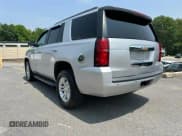 ✅ 2019 Chevrolet Tahoe LT • VIN: 1GNSKBKC5KR127144 • Lot: 61031915. Listed on Copart with 123,069 mi. Free auction sales archive from the USA and detailed vehicle history report at DreamBid. Image 2.