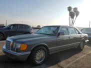 ✅ 1990 Mercedes-Benz 560 • VIN: WDBCA39E3LA553622 • Lot: 67322965. Listed on Copart with 142,659 mi. Free auction sales archive from the USA and detailed vehicle history report at DreamBid. Image 1.