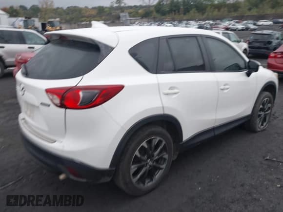 ✅ 2016 Mazda CX-5 Grand Touring • VIN: JM3KE4DY5G0760878 • Lot: 43450576. Wystawiony na IAAI z przebiegiem 143 780 mil. Bezpłatny archiwum sprzedaży aukcyjnych z USA i szczegółowy raport historii pojazdu na DreamBid. Zdjęcie 4.