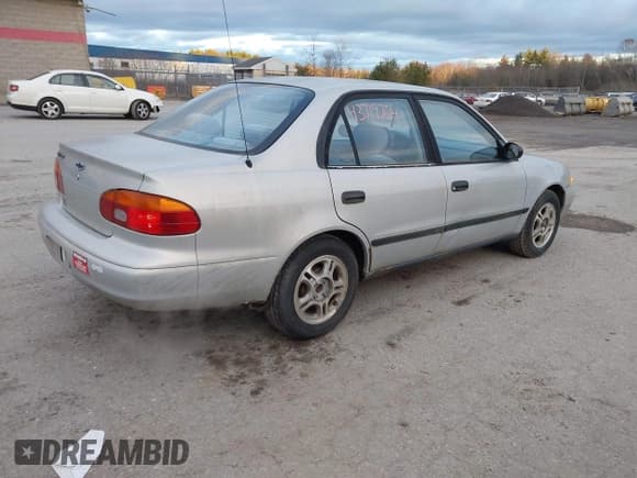 ✅ 2000 Chevrolet Prizm • VIN: 1Y1SK5281YZ411235 • Lot: 43719764. Listed on IAAI with 96,400 mi. Free auction sales archive from the USA and detailed vehicle history report at DreamBid. Image 4.