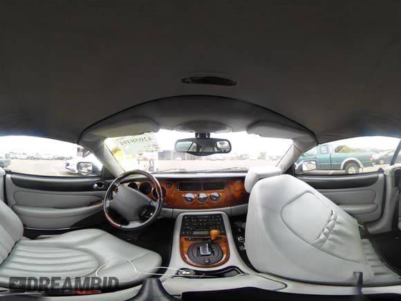 ✅ 2003 Jaguar XK • VIN: SAJDA42C232A34869 • Lot: 42058494. Listed on IAAI with 33,868 mi. Free auction sales archive from the USA and detailed vehicle history report at DreamBid. Image 19.