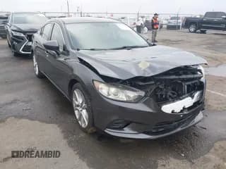 ✅ 2014 Mazda 6 i Touring • VIN: JM1GJ1V62E1145671 • Lot: 43791758. Listed on IAAI with 138,360 mi. Free auction sales archive from the USA and detailed vehicle history report at DreamBid. Image 1.