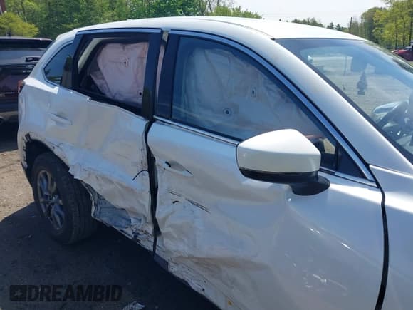 ✅ 2021 Mazda CX-9 Touring • VIN: JM3TCBCYXM0521323 • Lot: 42190976. Listed on IAAI with 56,652 mi. Free auction sales archive from the USA and detailed vehicle history report at DreamBid. Image 6.