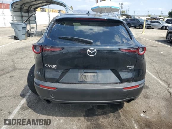✅ 2023 Mazda CX-30 Premium • VIN: 3MVDMBDY2PM503035 • Lot: 80368565. Wystawiony na Copart z przebiegiem 51 174 mil. Bezpłatny archiwum sprzedaży aukcyjnych z USA i szczegółowy raport historii pojazdu na DreamBid. Zdjęcie 6.