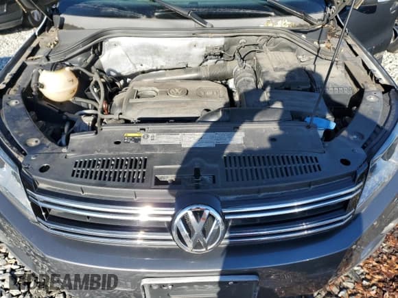 ✅ 2013 Volkswagen Tiguan S • VIN: WVGBV3AXXDW585174 • Lot: 93643875. Listed on Copart with 143,089 mi. Free auction sales archive from the USA and detailed vehicle history report at DreamBid. Image 12.