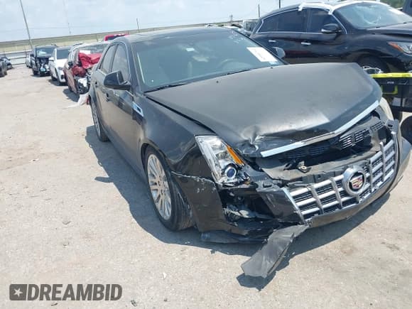 ✅ 2012 Cadillac CTS Premium • VIN: 1G6DP5E38C0127745 • Lot: 42950762. Listed on IAAI with 127,023 mi. Free auction sales archive from the USA and detailed vehicle history report at DreamBid. Image 1.