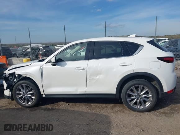 ✅ 2019 Mazda CX-5 Grand Touring • VIN: JM3KFADM1K1677914 • Лот: 43627333. Опубликован ранее на IAAI с пробегом 109 565 миль. Бесплатный доступ к архиву аукционных продаж из США и подробный отчёт об истории автомобиля на DreamBid. Изображение 15.