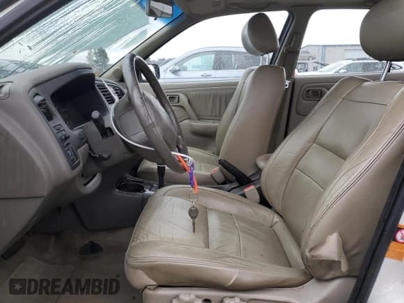 ✅ 1999 Infiniti G20 • VIN: JNKCP11A4XT018885 • Lot: 84072594. Wystawiony na Copart z przebiegiem 237 072 mil. Bezpłatny archiwum sprzedaży aukcyjnych z USA i szczegółowy raport historii pojazdu na DreamBid. Zdjęcie 7.