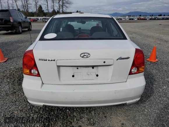 2003 Hyundai Accent GL z VIN KMHCG45C63U485420, wystawiony jako Copart lot #48251265 z przebiegiem 139 179 mil mil oraz Szkoda całkowita • Salvage title. Historia ofert i sprzedaży dostępna na DreamBid. Obrazek 6.