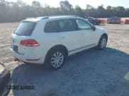 ✅ 2011 Volkswagen Touareg Sport • VIN: WVGFF9BPXBD005639 • Lot: 43065296. Listed on IAAI with 201,148 mi. Free auction sales archive from the USA and detailed vehicle history report at DreamBid. Image 4.