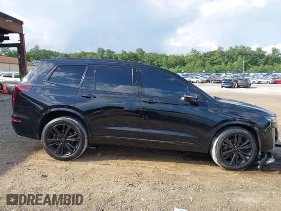 ✅ 2023 Cadillac XT6 AWD Premium Luxury • VIN: 1GYKPDRS6PZ135869 • Лот: 43114241. Опубликован ранее на IAAI с пробегом 82 532 миль. Бесплатный доступ к архиву аукционных продаж из США и подробный отчёт об истории автомобиля на DreamBid. Изображение 13.