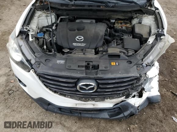 ✅ 2016 Mazda CX-5 Grand Touring • VIN: JM3KE4DY9G0666163 • Лот: 84364035. Опубликован ранее на Copart с пробегом 127 136 миль. Бесплатный доступ к архиву аукционных продаж из США и подробный отчёт об истории автомобиля на DreamBid. Изображение 12.