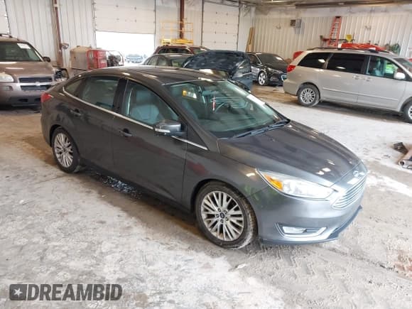 ✅ 2015 Ford Focus Titanium • VIN: 1FADP3J22FL260718 • Lot: 42545411. Listed on IAAI with 83,518 mi. Free auction sales archive from the USA and detailed vehicle history report at DreamBid. Image 1.