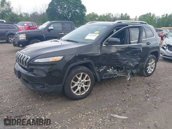 ✅ 2014 Jeep Cherokee Altitude • VIN: 1C4PJMCS4EW297696 • Lot: 42459285. Listed on IAAI with 196,772 mi. Free auction sales archive from the USA and detailed vehicle history report at DreamBid. Image 2.