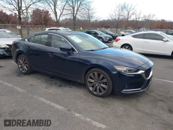 ✅ 2020 Mazda 6 Grand Touring Reserve • VIN: JM1GL1WY1L1512101 • Lot: 43678096. Listed on IAAI with 234,610 mi. Free auction sales archive from the USA and detailed vehicle history report at DreamBid. Image 1.
